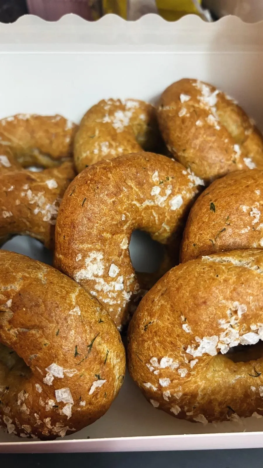 Dill bagels topped with flaky sea salt