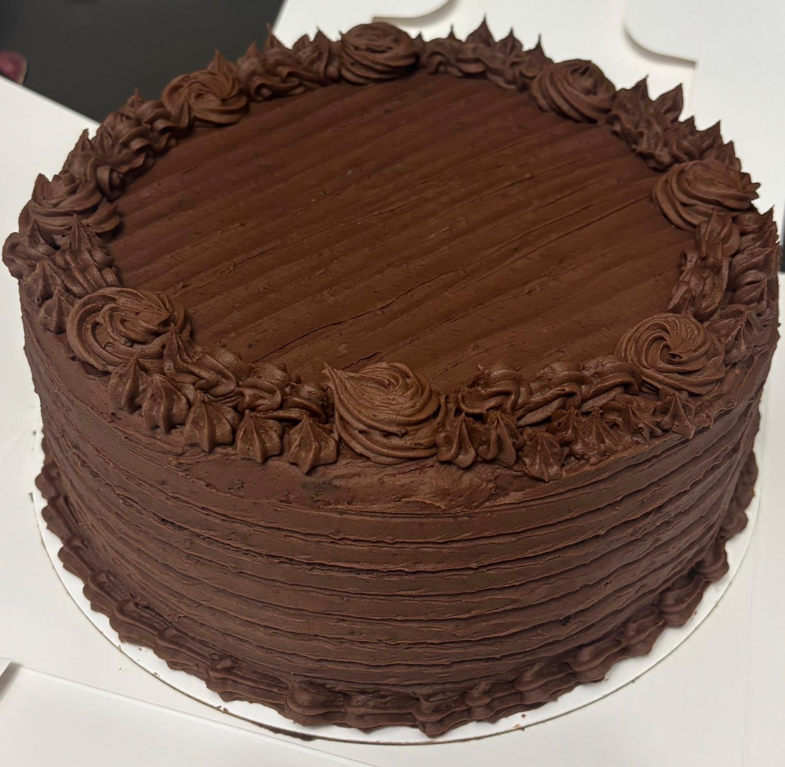 Custom chocolate cake with piped rosettes
