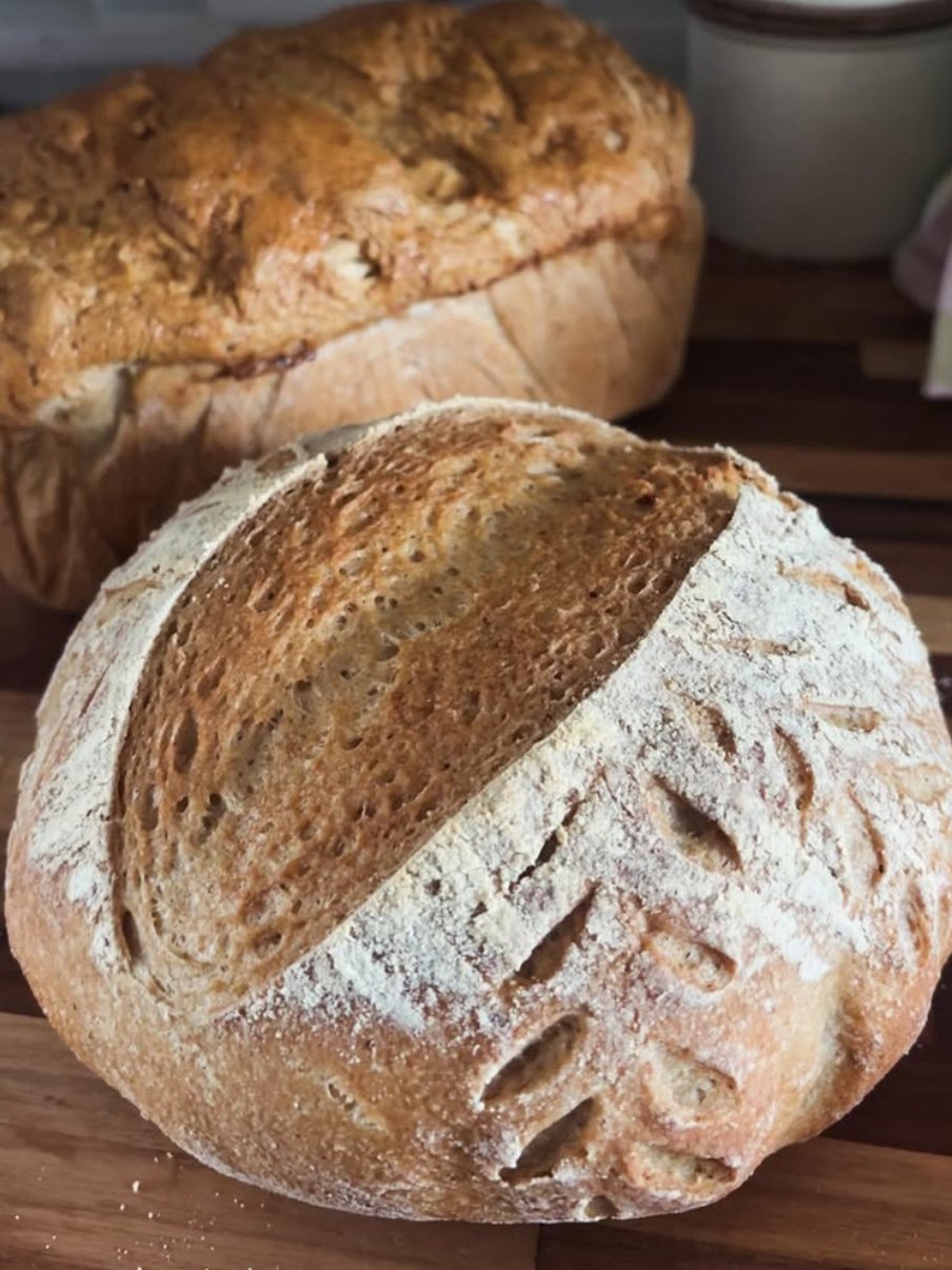 Two sourdough boules on a cutting board